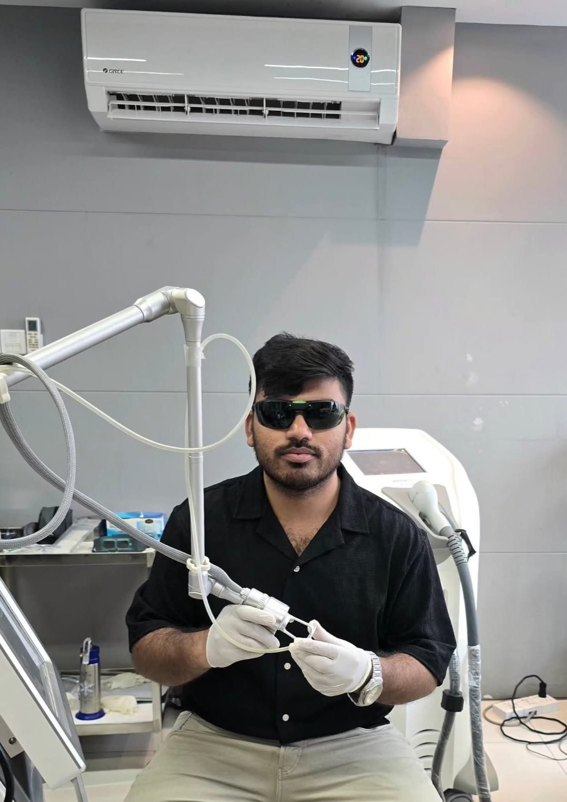 Dr. Khaled Hasan Milu performing a laser treatment at his chamber