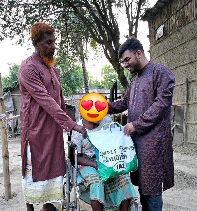 Dr. Khaled Hasan Milu helping an underprivileged elderly patient in his village