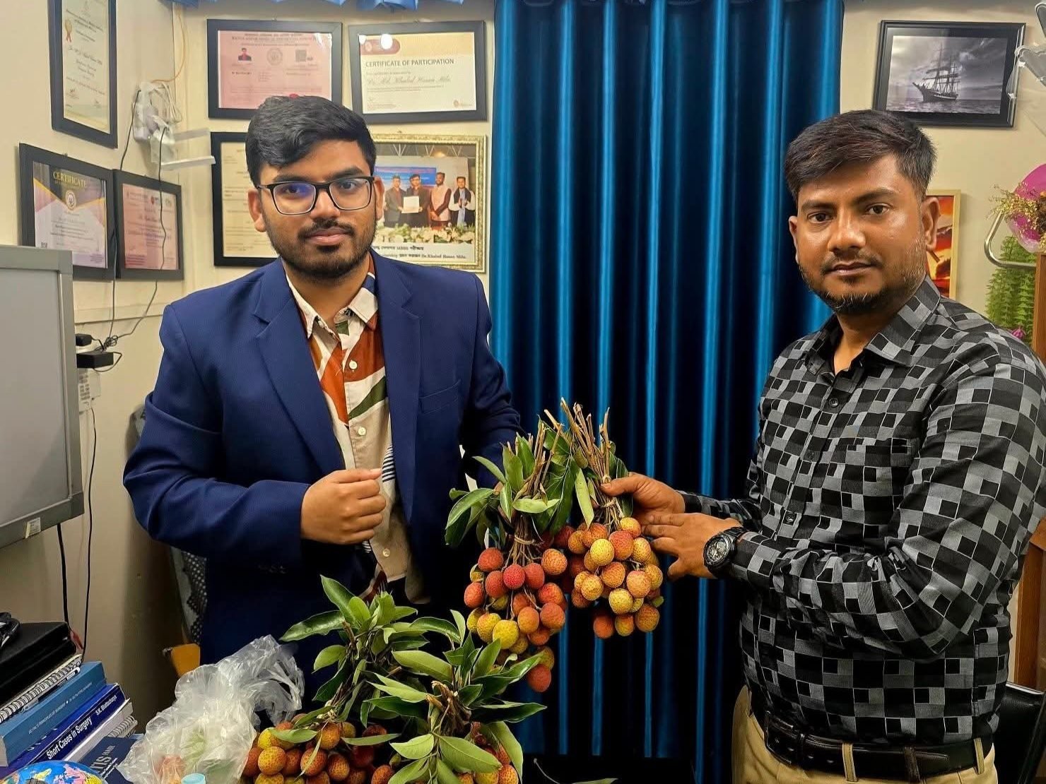 A patient bringing lychees from the chamber's own tree as a gift to Dr. Khaled Hasan Milu